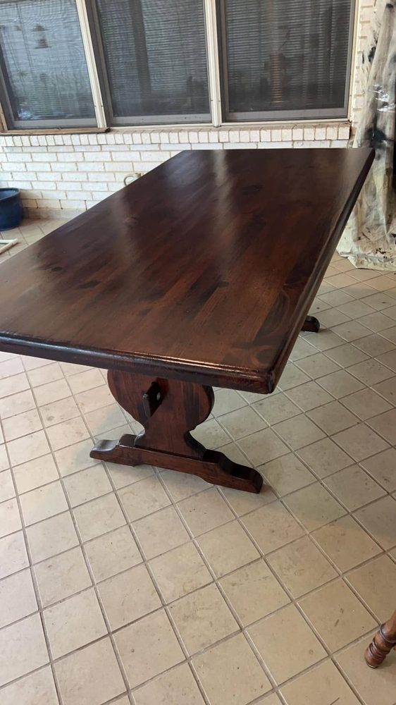 A pine trestle dining table stripped and refinished dark