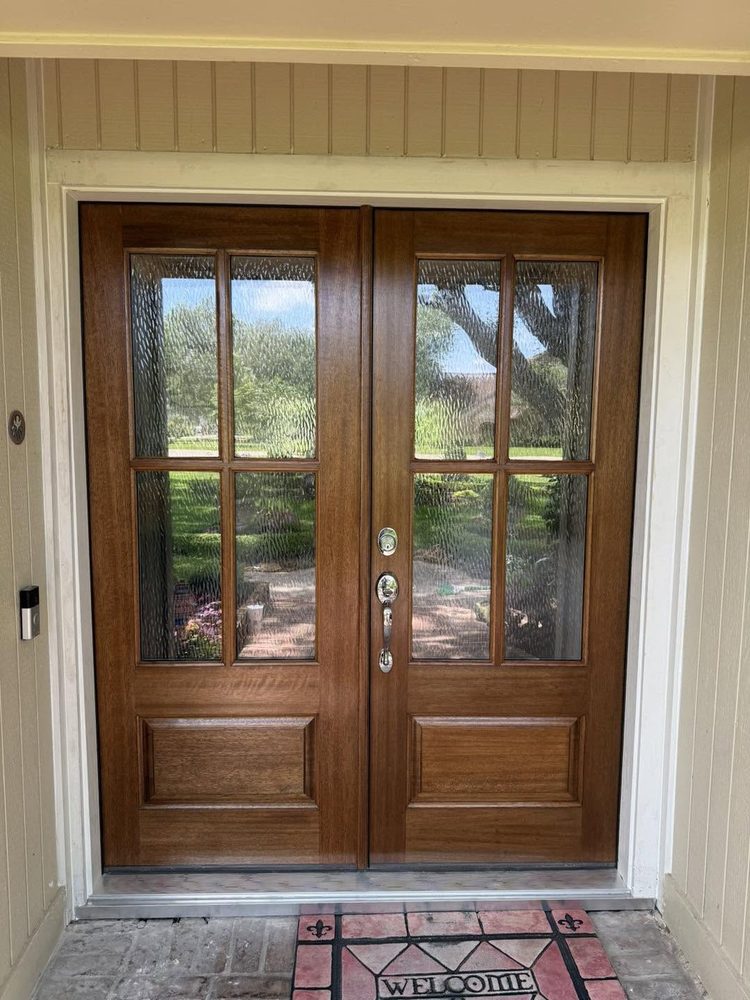 Mahogany double doors fitted where a painted door and sidelights used to be